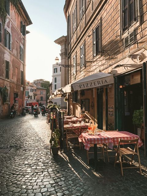 A trattoria on a cobbled street in Rome